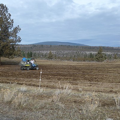 An ATV is used to apply herbicide in large, accessible areas like fields. Photo: Land Trust. 