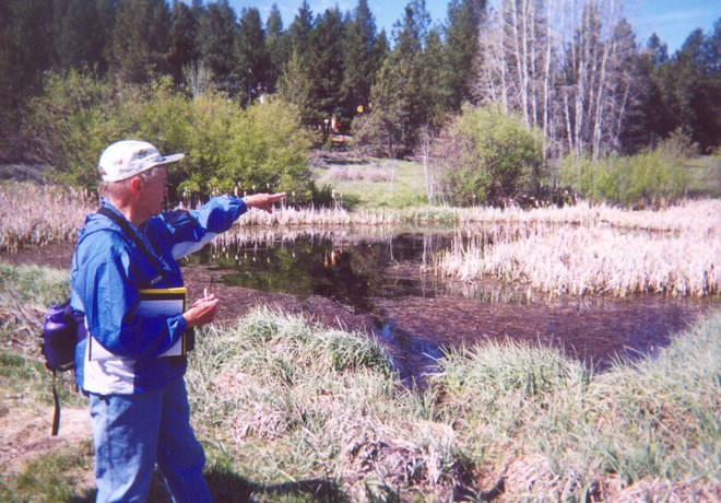 Norma Funai leads one of the first public tours of Camp Polk Meadow Preserve in 2002. Photo: Land Trust.